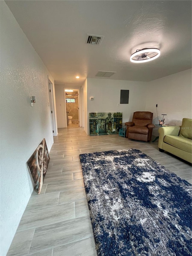 5727 Beechwood St, Punta Gorda, FL 33982 - living room featuring a textured wall