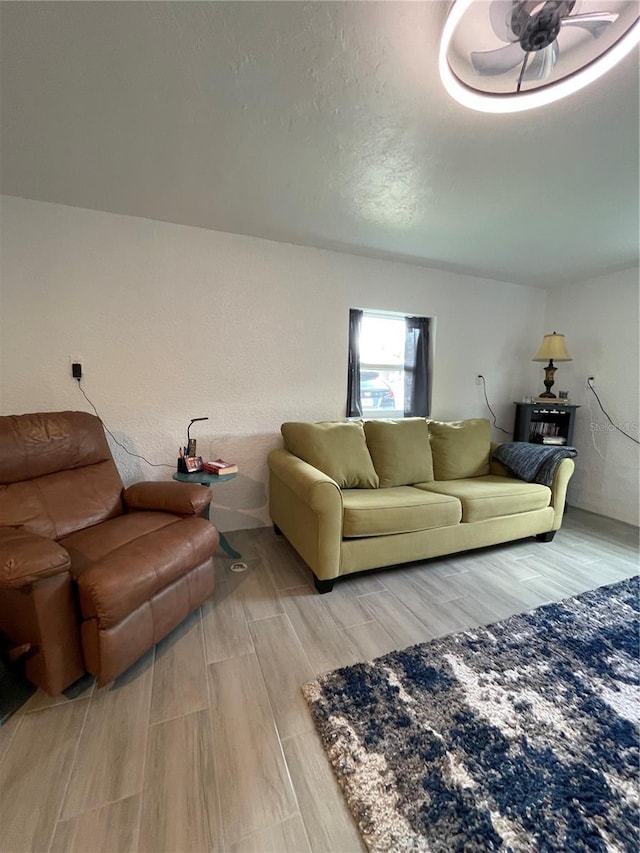 5727 Beechwood St, Punta Gorda, FL 33982 - living area with wood finish floors and ceiling fan