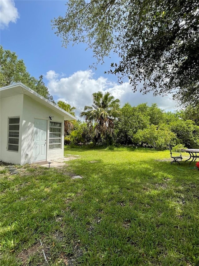 5727 Beechwood St, Punta Gorda, FL 33982 - view of green lawn featuring an outbuilding