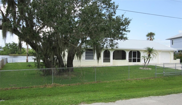 9986 SW Riverview Cir, Arcadia, FL 34269 - view of front of property featuring a garage, stucco siding, and a water view