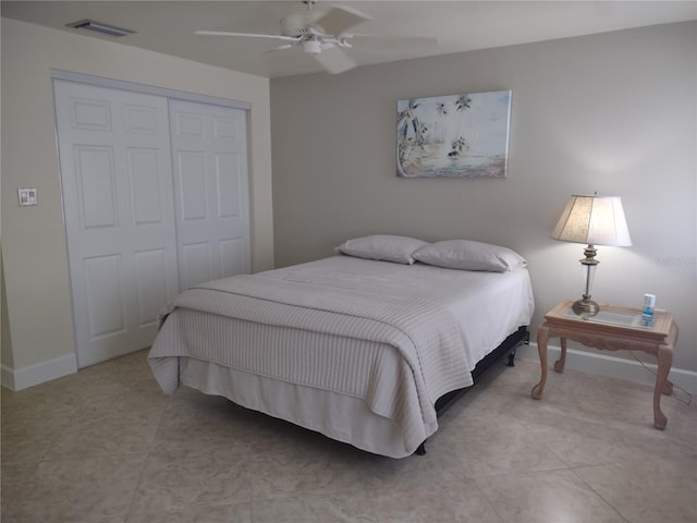9986 SW Riverview Cir, Arcadia, FL 34269 - bedroom with a closet, a ceiling fan, and light tile patterned floors