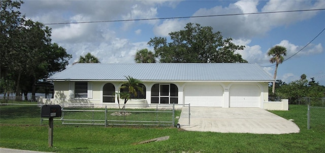9986 SW Riverview Cir, Arcadia, FL 34269 - single story home featuring an attached garage, stucco siding, driveway, a fenced front yard, and a metal roof