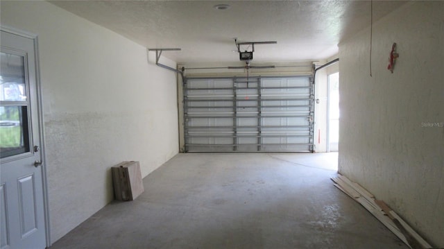 9986 SW Riverview Cir, Arcadia, FL 34269 - garage featuring a garage door opener