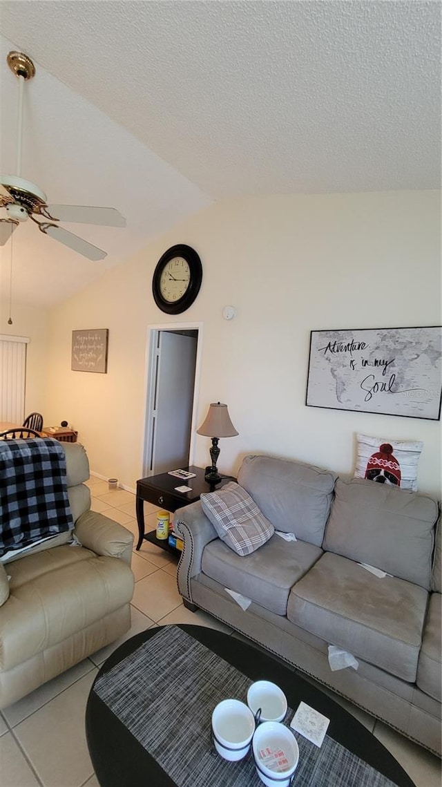 13366 Ballon Ave, Port Charlotte, FL 33981 - living room featuring a ceiling fan, vaulted ceiling, and light tile patterned floors