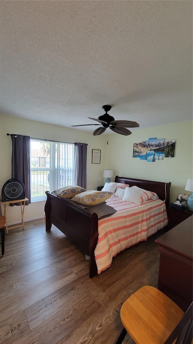 13366 Ballon Ave, Port Charlotte, FL 33981 - bedroom featuring a textured ceiling, wood finished floors, and ceiling fan