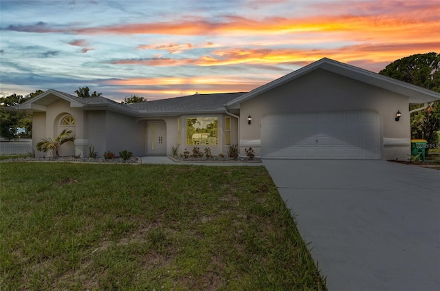 229 Waterside St, Port Charlotte, FL 33954 - ranch-style home featuring stucco siding, a garage, driveway, and a yard