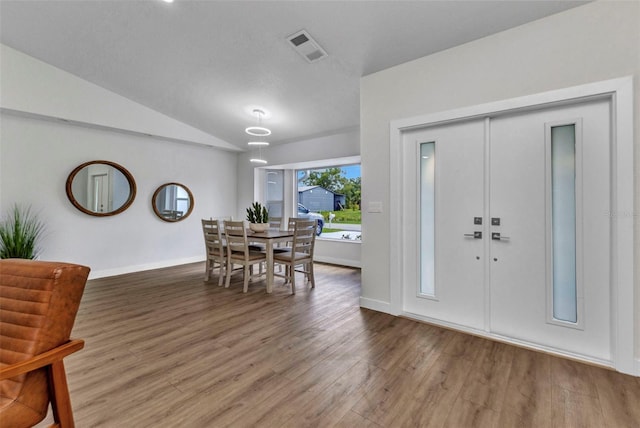 229 Waterside St, Port Charlotte, FL 33954 - entrance foyer with wood finished floors and vaulted ceiling