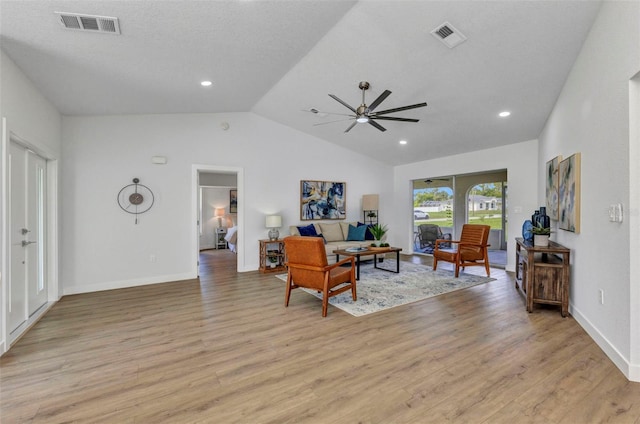 229 Waterside St, Port Charlotte, FL 33954 - living room with vaulted ceiling, light wood finished floors, a ceiling fan, and recessed lighting