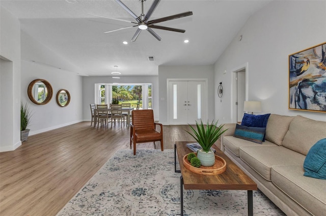 229 Waterside St, Port Charlotte, FL 33954 - living room featuring lofted ceiling, wood finished floors, a ceiling fan, and recessed lighting