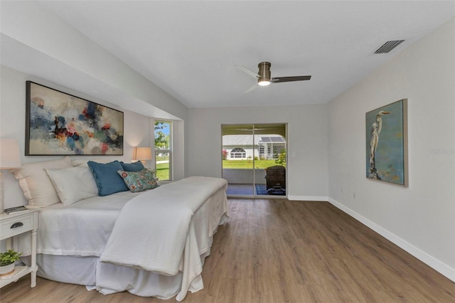 229 Waterside St, Port Charlotte, FL 33954 - bedroom featuring access to exterior, wood finished floors, and ceiling fan