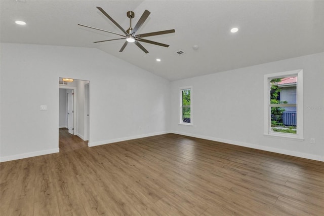 229 Waterside St, Port Charlotte, FL 33954 - spare room featuring lofted ceiling, ceiling fan, wood finished floors, and recessed lighting