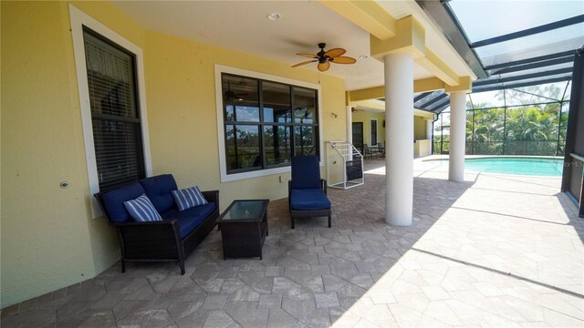 6057 Calusa Ridge Trl, Bokeelia, FL 33922 - view of patio featuring a ceiling fan, an outdoor pool, an outdoor living space, and glass enclosure