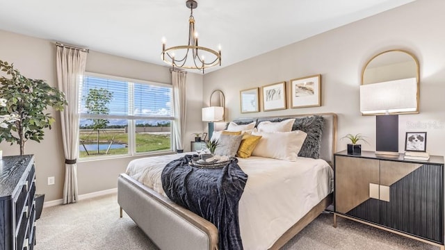 9710 Sand Dune Ln, Punta Gorda, FL 33950 - bedroom featuring light colored carpet, a chandelier, and baseboards