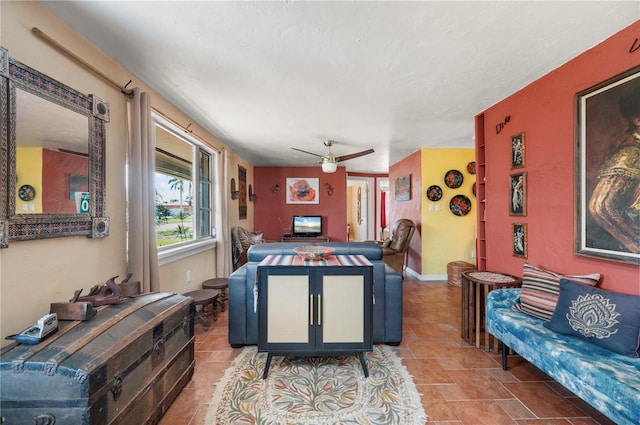 611 Bonita Ct, Punta Gorda, FL 33950 - living room featuring a ceiling fan and stone finish flooring