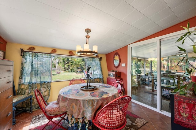 611 Bonita Ct, Punta Gorda, FL 33950 - dining area featuring healthy amount of natural light, a chandelier, tile patterned floors, and vaulted ceiling