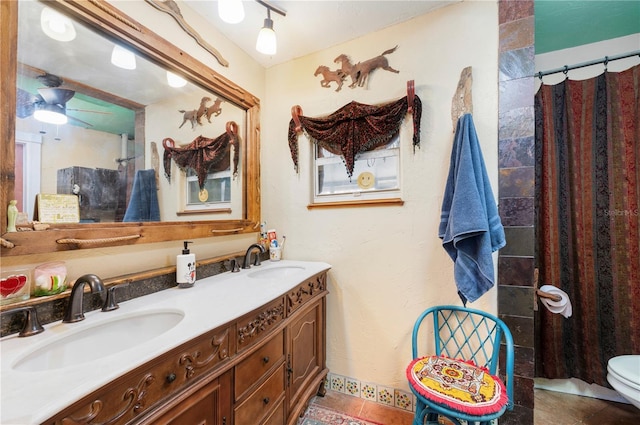 611 Bonita Ct, Punta Gorda, FL 33950 - full bath featuring double vanity, toilet, a shower with curtain, and ceiling fan