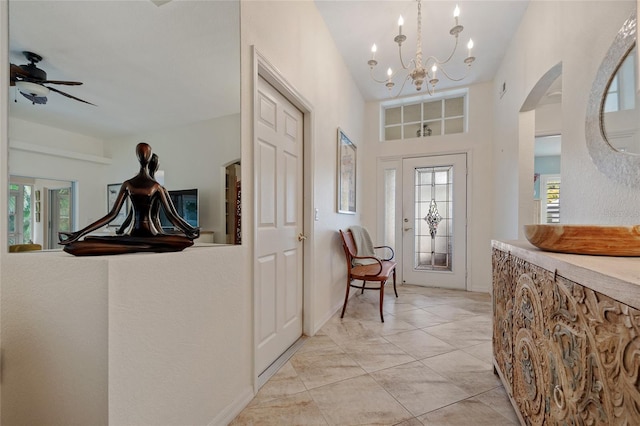 1812 Birmingham Blvd, Punta Gorda, FL 33980 - entrance foyer with arched walkways, plenty of natural light, a ceiling fan, and a chandelier