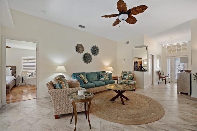 1812 Birmingham Blvd, Punta Gorda, FL 33980 - living room with a ceiling fan, healthy amount of natural light, a chandelier, and light tile patterned flooring