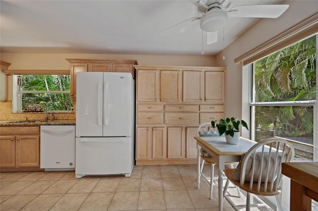 1812 Birmingham Blvd, Punta Gorda, FL 33980 - kitchen with white appliances, ceiling fan, stone counters, light tile patterned floors, and light brown cabinets