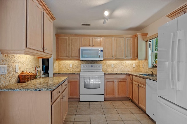 1812 Birmingham Blvd, Punta Gorda, FL 33980 - kitchen featuring white appliances, backsplash, stone counters, light tile patterned floors, and light brown cabinetry