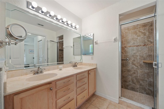 1812 Birmingham Blvd, Punta Gorda, FL 33980 - bathroom featuring a stall shower, double vanity, and tile patterned flooring