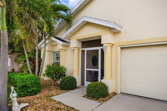 1812 Birmingham Blvd, Punta Gorda, FL 33980 - doorway to property featuring stucco siding and an attached garage