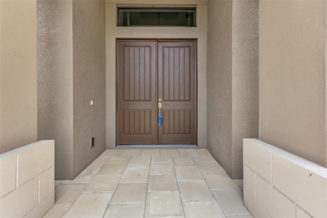 5451 Prime Ter, North Port, FL 34286 - property entrance with stucco siding and french doors