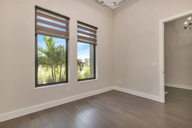 5451 Prime Ter, North Port, FL 34286 - empty room featuring a chandelier, baseboards, and dark wood-type flooring