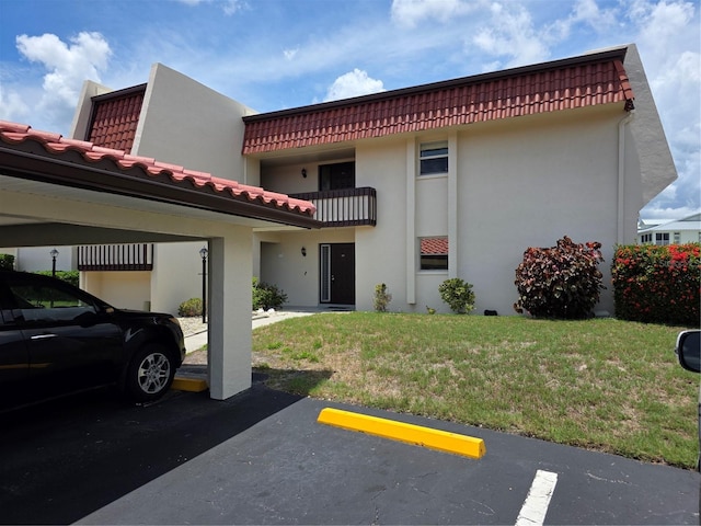 311 Garvin St Unit 405B, Punta Gorda, FL 33950 - view of property featuring covered and uncovered parking