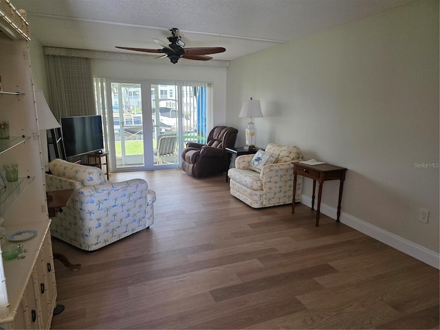 311 Garvin St Unit 405B, Punta Gorda, FL 33950 - living area with a ceiling fan, wood finished floors, and baseboards