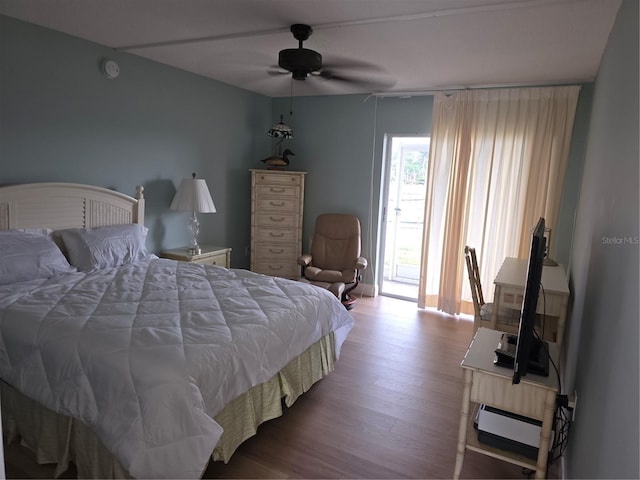 311 Garvin St Unit 405B, Punta Gorda, FL 33950 - bedroom with wood finished floors, a baseboard radiator, and ceiling fan