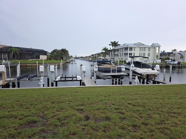 311 Garvin St Unit 405B, Punta Gorda, FL 33950 - dock area with boat lift, a water view, and a yard