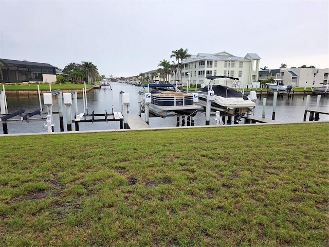 311 Garvin St Unit 405B, Punta Gorda, FL 33950 - dock area with boat lift, a water view, and a lawn