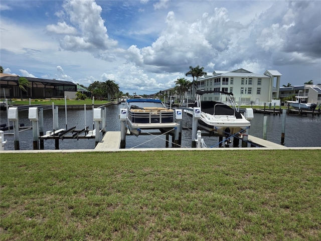 311 Garvin St Unit 405B, Punta Gorda, FL 33950 - dock featuring boat lift, a water view, and a yard
