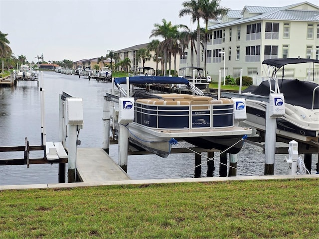 311 Garvin St Unit 405B, Punta Gorda, FL 33950 - dock area with boat lift, a water view, and a yard