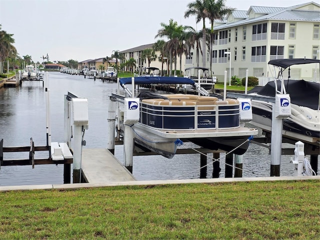 311 Garvin St Unit 405B, Punta Gorda, FL 33950 - dock area with boat lift, a water view, and a yard