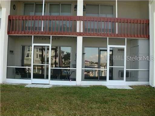 311 Garvin St Unit 405B, Punta Gorda, FL 33950 - back of house with a yard and a balcony