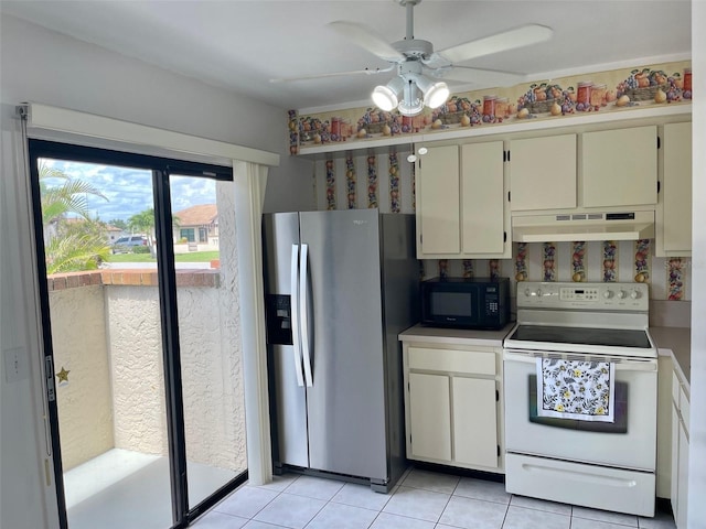 13100 S Mccall Rd Unit 125, Port Charlotte, FL 33981 - kitchen with electric range, under cabinet range hood, stainless steel fridge with ice dispenser, black microwave, and a ceiling fan