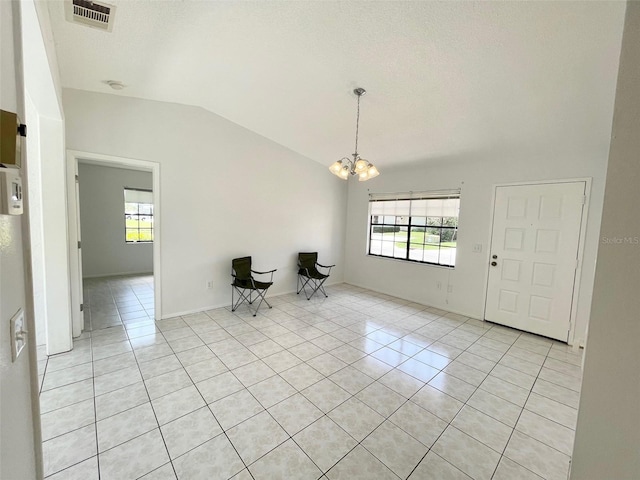 13100 S Mccall Rd Unit 125, Port Charlotte, FL 33981 - entryway with lofted ceiling, light tile patterned floors, plenty of natural light, and a chandelier