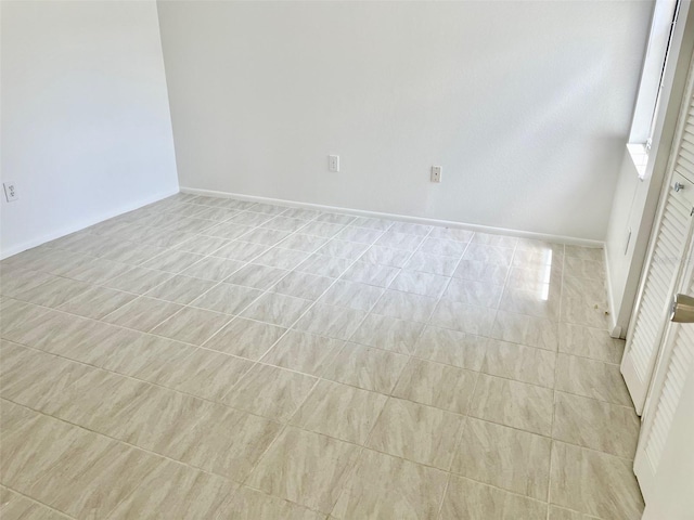 13100 S Mccall Rd Unit 125, Port Charlotte, FL 33981 - spare room with baseboards and light tile patterned floors