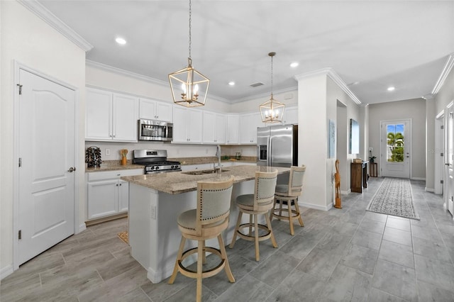 16176 Lotus Way, Punta Gorda, FL 33982 - kitchen featuring appliances with stainless steel finishes, a sink, a chandelier, crown molding, and recessed lighting