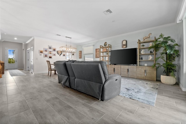 16176 Lotus Way, Punta Gorda, FL 33982 - living room with a chandelier, ornamental molding, and baseboards
