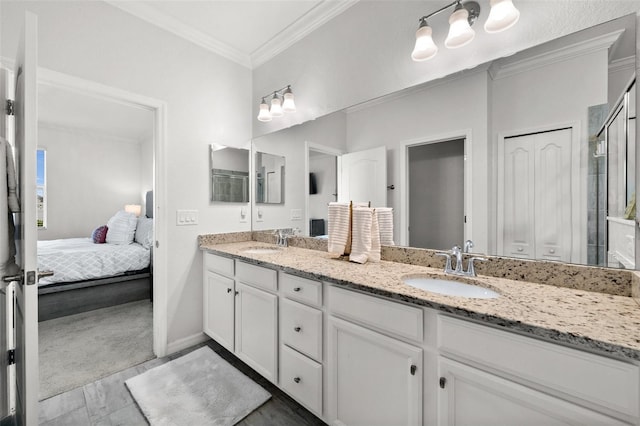 16176 Lotus Way, Punta Gorda, FL 33982 - ensuite bathroom with double vanity, ornamental molding, baseboards, and a shower with shower door