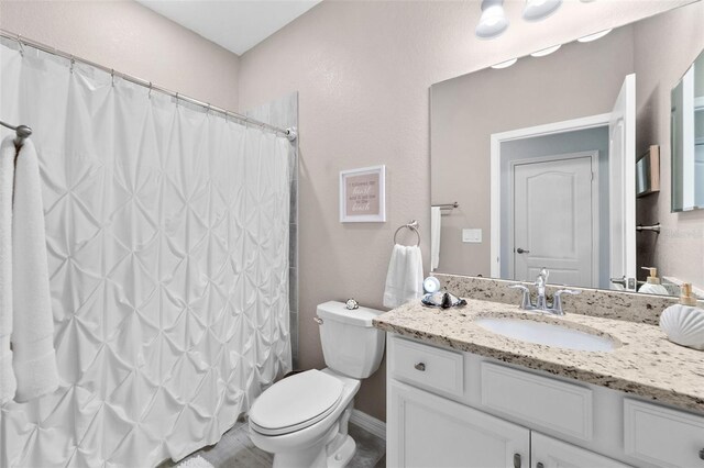 16176 Lotus Way, Punta Gorda, FL 33982 - bathroom featuring toilet, vanity, and a shower with curtain