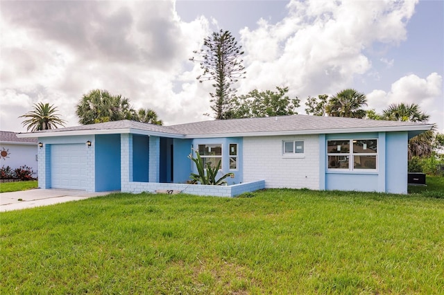 37 Oakland Hills Ct, Rotonda West, FL 33947 - view of front of home with an attached garage, a front yard, and driveway