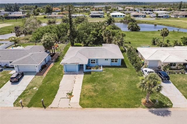 37 Oakland Hills Ct, Rotonda West, FL 33947 - aerial perspective of suburban area featuring a large body of water