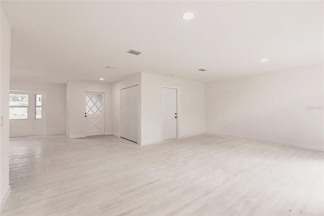 37 Oakland Hills Ct, Rotonda West, FL 33947 - spare room with light wood finished floors, recessed lighting, and baseboards