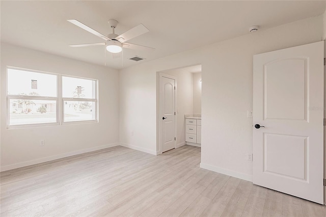 37 Oakland Hills Ct, Rotonda West, FL 33947 - unfurnished bedroom with light wood-type flooring, baseboards, and ceiling fan