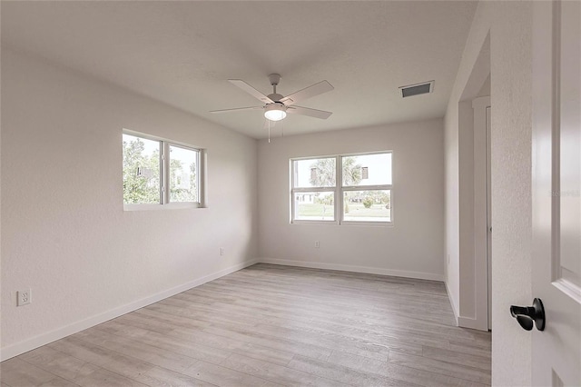 37 Oakland Hills Ct, Rotonda West, FL 33947 - unfurnished bedroom featuring light wood finished floors, baseboards, and ceiling fan