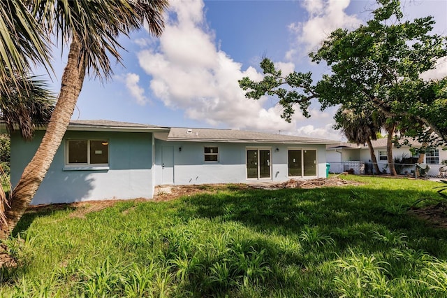 37 Oakland Hills Ct, Rotonda West, FL 33947 - back of property with stucco siding